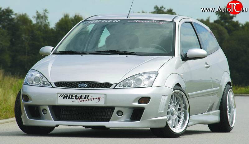 8 899 р. Передний бампер Rieger  Ford Focus  1 (1998-2005) седан дорестайлинг, универсал дорестайлинг, хэтчбэк 3 дв. дорестайлинг, хэтчбэк 5 дв. дорестайлинг, седан рестайлинг, универсал рестайлинг, хэтчбэк 3 дв. рестайлинг, хэтчбэк 5 дв. рестайлинг  с доставкой в г. Тамбов